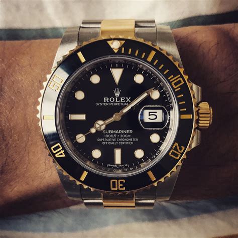 rolex oyster perpetual submariner black and gold